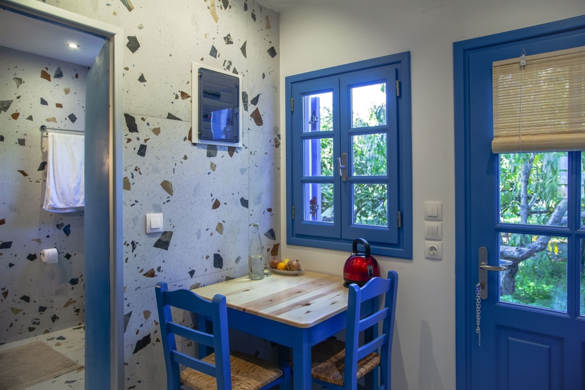 Kitchen table near blue window.