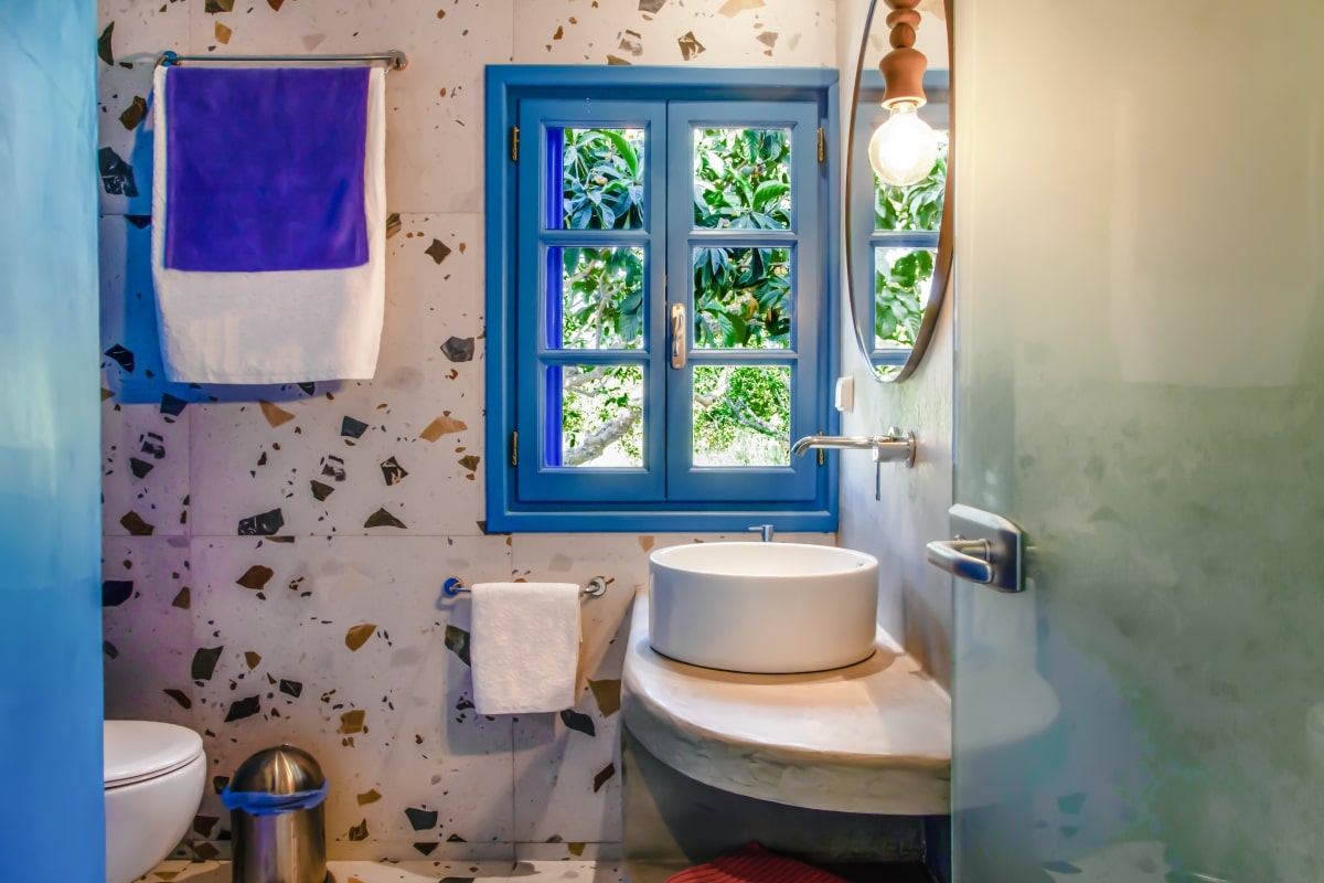 Clean and fresh bathroom with a blue window.